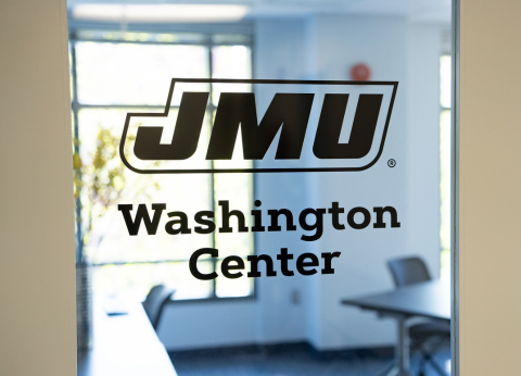 A window vinyl sticker on a glass door reads JMU Washington Semester.