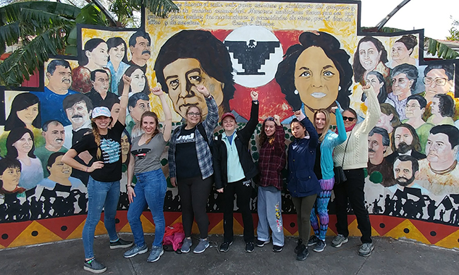 Group of students and faculty at US-Mexico border