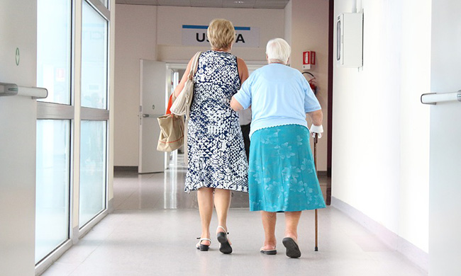 PHOTO: Elderly patient being helped