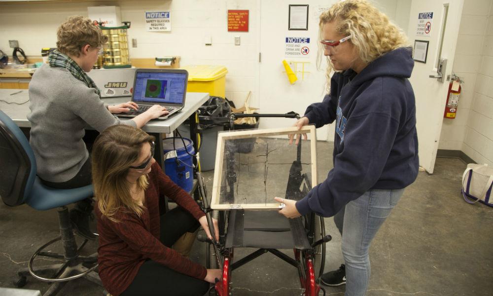 image: /_images/cise/story-photos/week-of-making/engineering-students-working-on-wheelchair.jpg