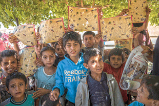 Children share materials with their parents and siblings, thereby multiplying the learning effects. Following the session, these children know the hotline number by heart.