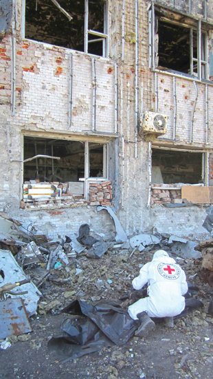 ICRC recovers human remains at an airport in Donetsk, Ukraine, in 2015. 