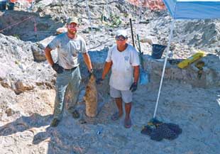 Personnel from the QRF and Kiribati Police Service (KPS) recover ERW. Image courtesy of GWHF.