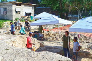 History Flight recovering human remains from the site. Image courtesy of GWHF.