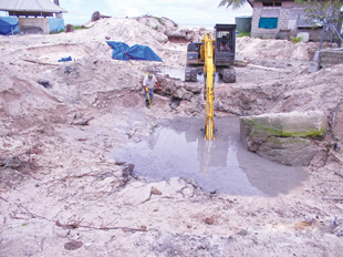 Human remains discovered, covered, and cordoned during ERW excavation of the site. Image courtesy of GWHF.