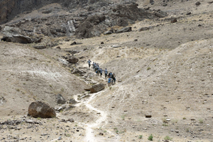 FSD manual clearance team descending from a hazardous area in Badakhshan, Afghanistan.