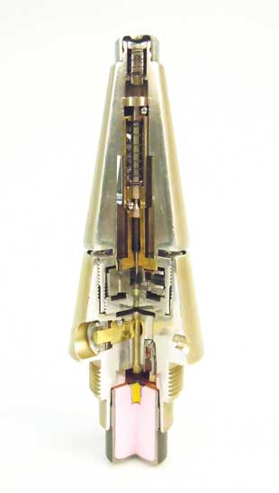 Figure 5 (left). An INERT MRV-U fuze complete. Note that the fuze appearance has been altered in order to make the item FFE. A full cut has been made above the shutter in order to gain access to the primers, stemming, and other energetic components. For some models, cuts on fuze bodies can be good initial indicators as to whether energetics have been removed and the item really is FFE. A window to view the setback sleeve has also been added during the inerting process. Making such an item FFE is an explosive process that should be conducted with a high level of risk management. Figure courtesy of Dutch EOD Center.