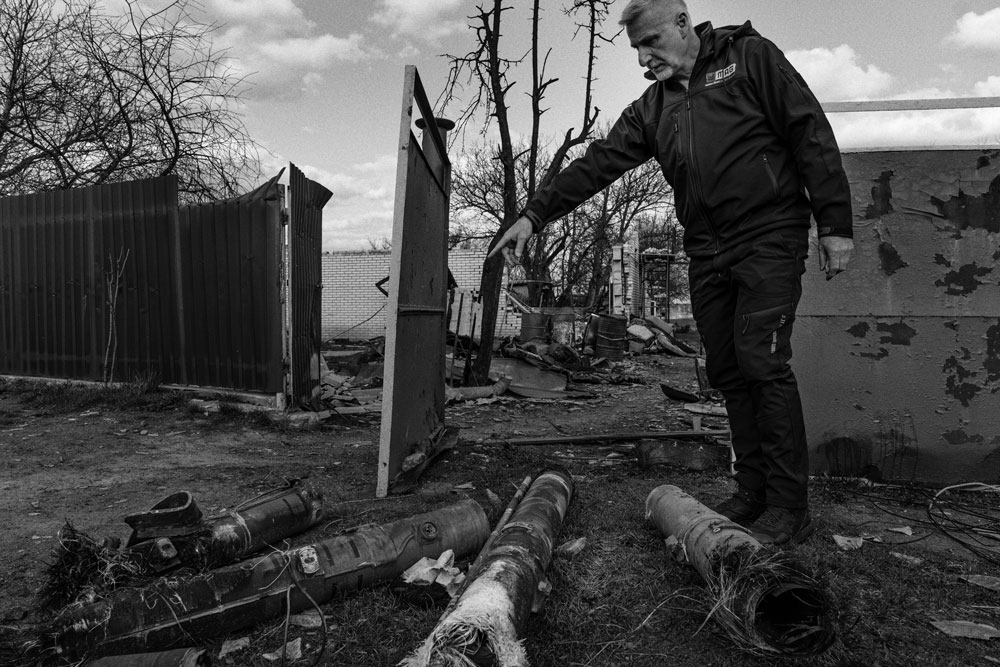 A MAG technical operations manager points to anti-tank missiles that still contain explosives