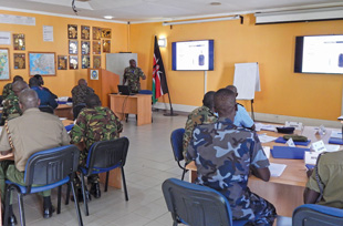 A regional instructor candidate conducting a module during a regional PSSM training-of-trainers in East Africa.