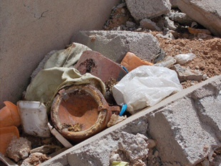 Image 10. Picture received reporting two explosive charges among rubble and garbage in West Mosul, Iraq.