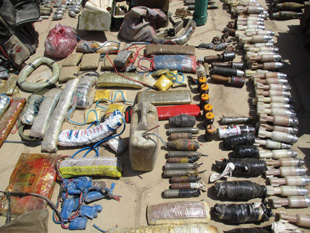 Image 13. Hundreds of IED main charges and IEDs recovered from a single site, East Mosul, Iraq.