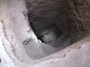  A nine-meter-deep excavation showing the tail of a bomb inside a house south of Mosul, Iraq. 
