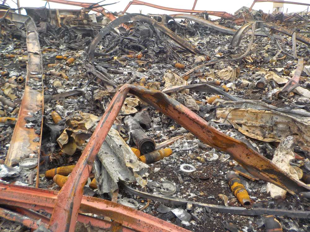 Debris consisting of warped metal and rusted ordnance.