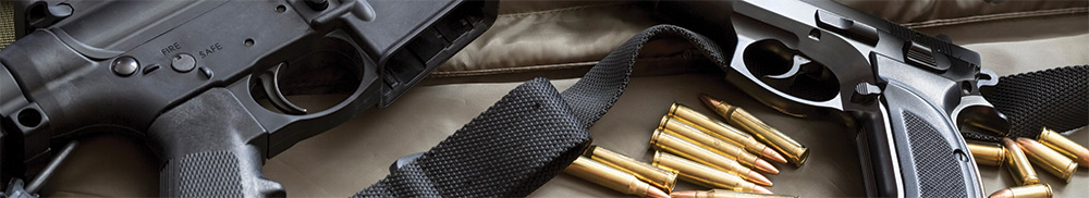 A rifle, a pistol and some loose ammunition.