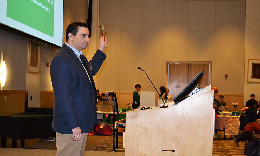 John Kruggel ringing the opening bell for the 2019 GEM Fair.