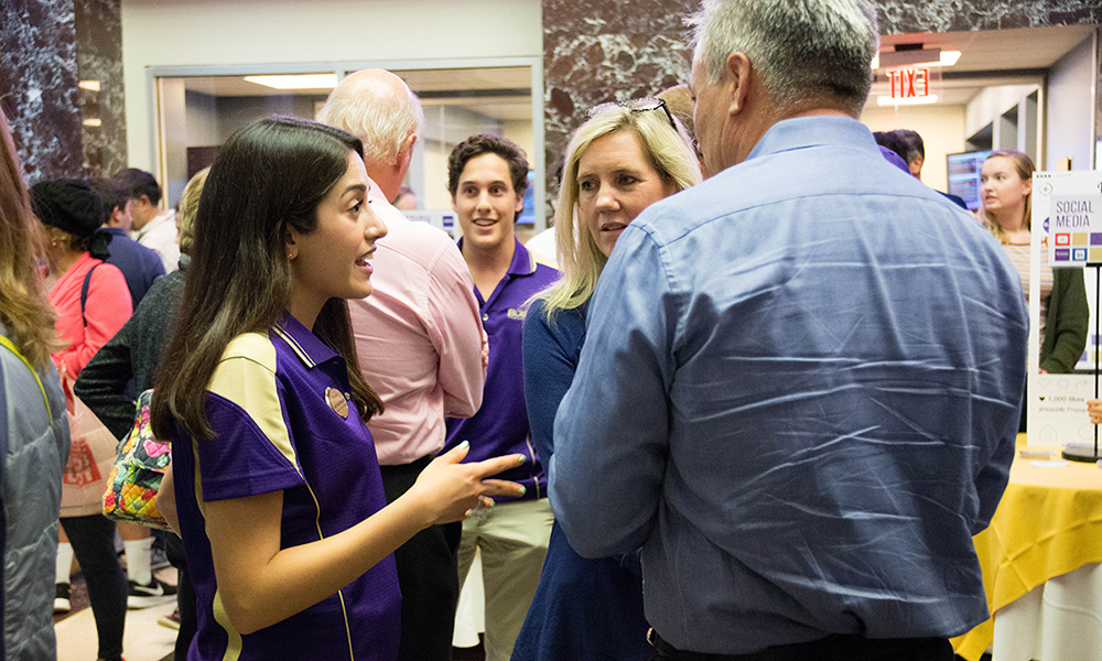 CoB staff member speaks with a student's family