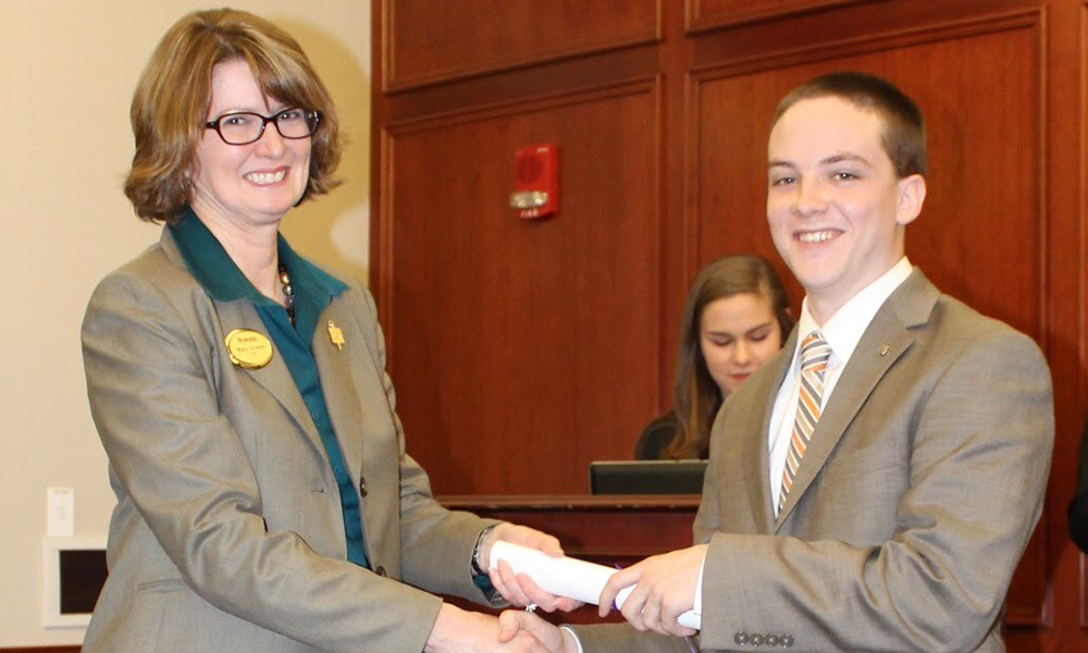 Alex McGuire receiving the ICPM Scholarship from Dean Mary Gowan 2016