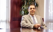 Management Professor Fariss Mousa in a CoB Conference Room - 2017