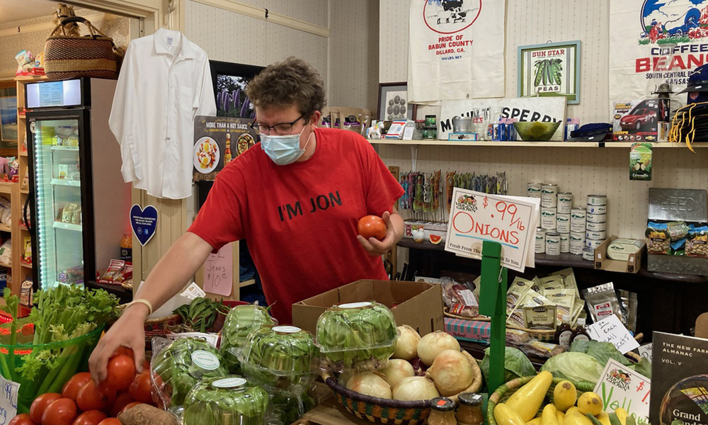 Jon Henry stocks products in his general store