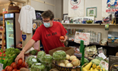 Jon Henry stocks products in his general store