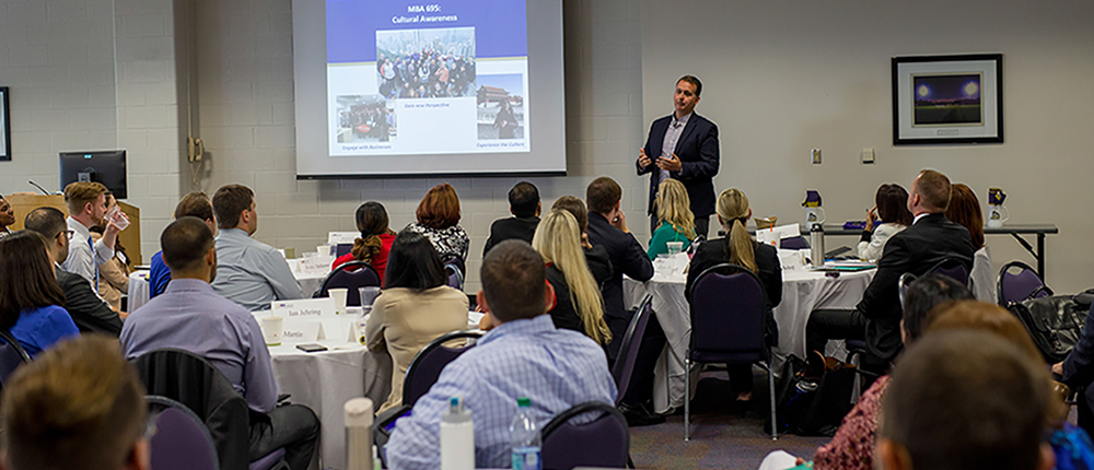 Matt Rutherford leading a presentation for MBA 695