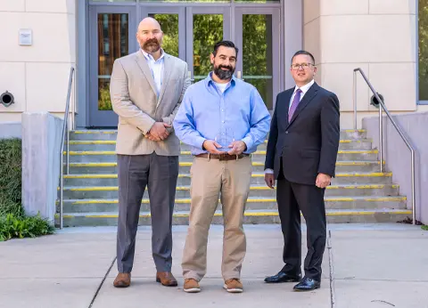 Left to right: Matt Von Schuch, YES advisory board member, John Kruggel, CEE director, and Michael Busing, dean of the College of Business.