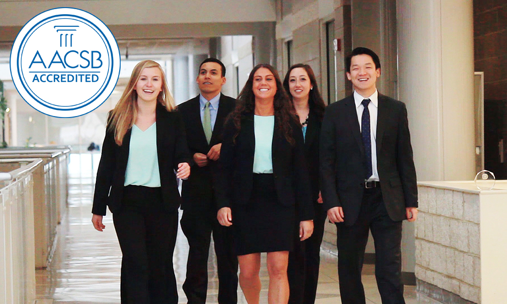 Accounting Students walking through a hallway - with AACSB logo