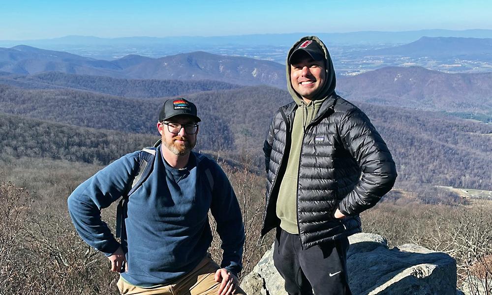 Harrisonburg-area veterans Mark Sackett (left) and Daly Simon (right) pause during a hike along Skyline Drive.