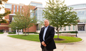 Charlie King outside of Hartman Hall