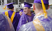 Graduating COB students in gowns and rain ponchos - 2016