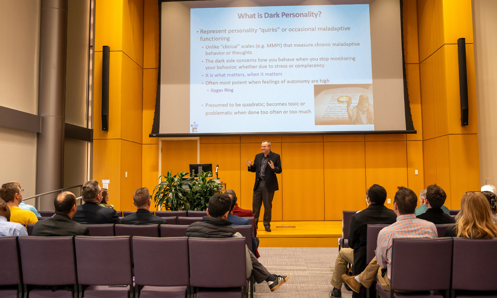 Peter Harms presents on stage in the Forum.