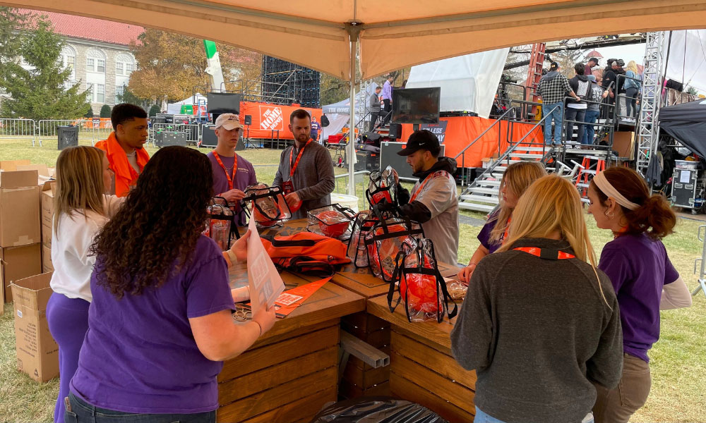 Hart School students stand under The Home Depot tent as they prepare for the day. 