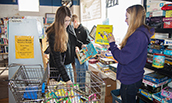 Management Students helping gather books on the 2018 MLK Day of Service