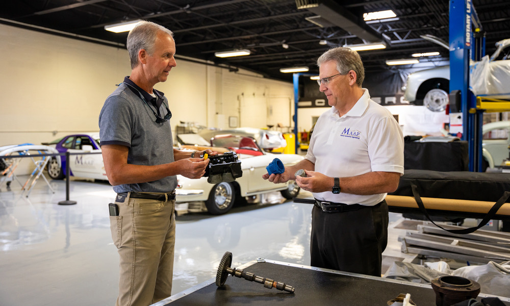 Professor of Business Management Bill Ritchie, left, (shown with Cole Scrogham of Madison Automotive Apprentices) is an expert on supply chains and their vulnerabilities.