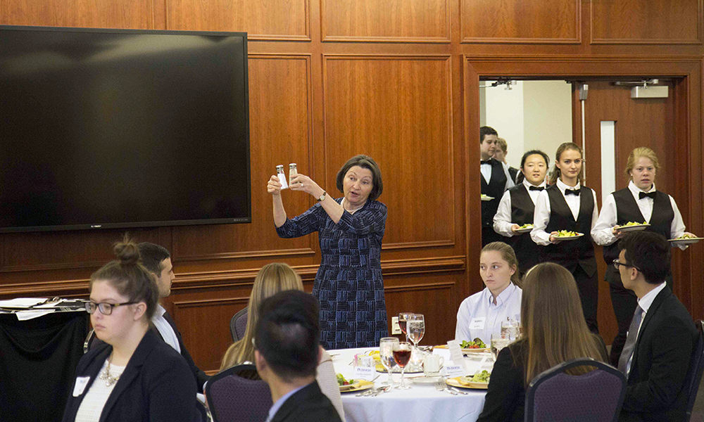 Etiquette pro demonstrating a point at the 2017 Etiquette Dinner