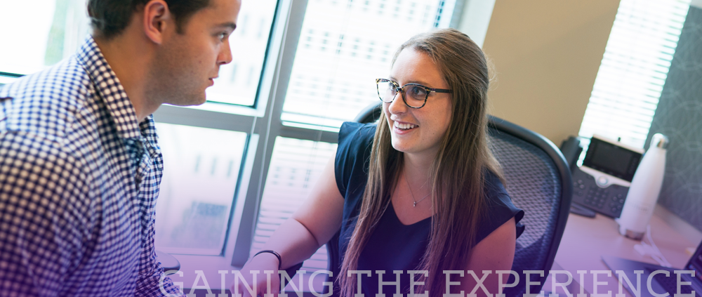 Gaining the Experience - a female CoB student talks with her supervisor during an internship