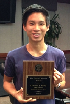 Cameron Young holding the Degesch Award in 2014