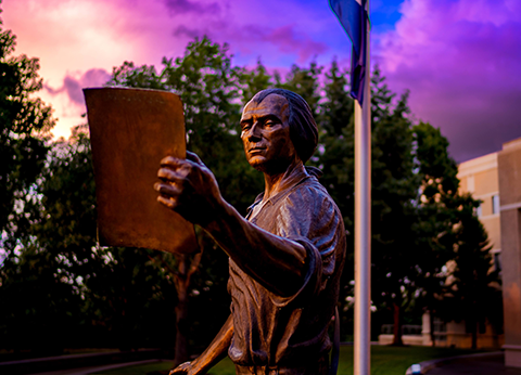 James Madison Statue with vivid purple sunset in background