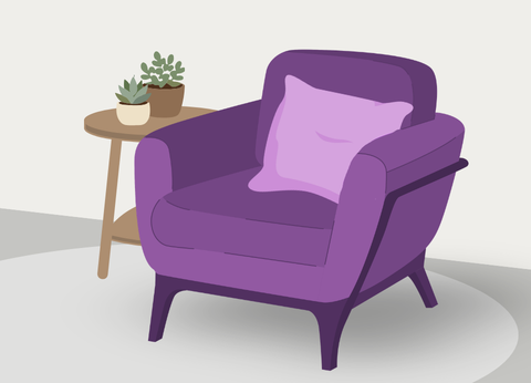 Rectangle image displaying a purple armchair with centered on a light gray circle carpet. Wooden table to left of chair with three legs and two small plants on table. 