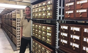 Photo of John Ott in library