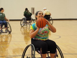 photo of student playing wheelchair basketball