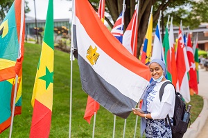 photo of student with international flags
