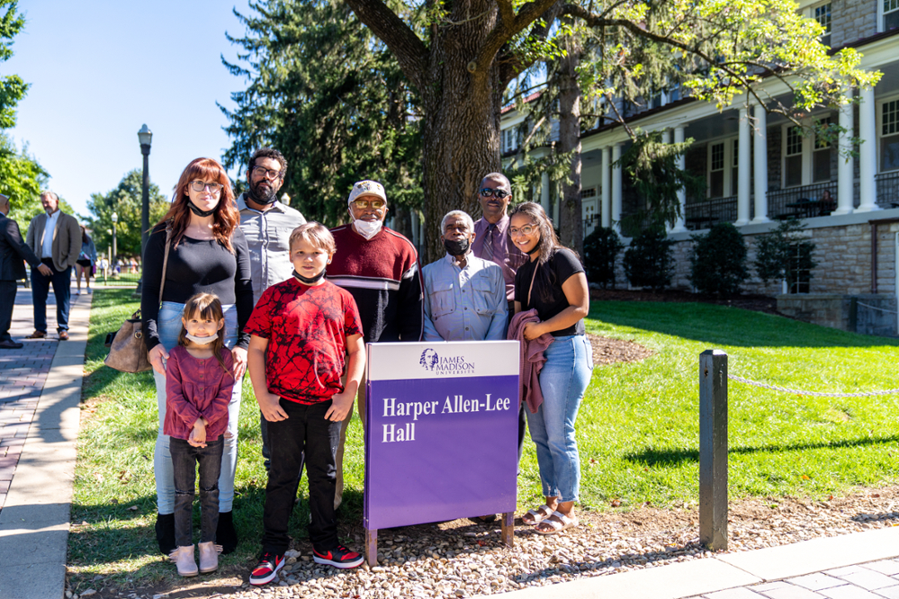photo of friends in front of Harper Allen-Lee Hall sign