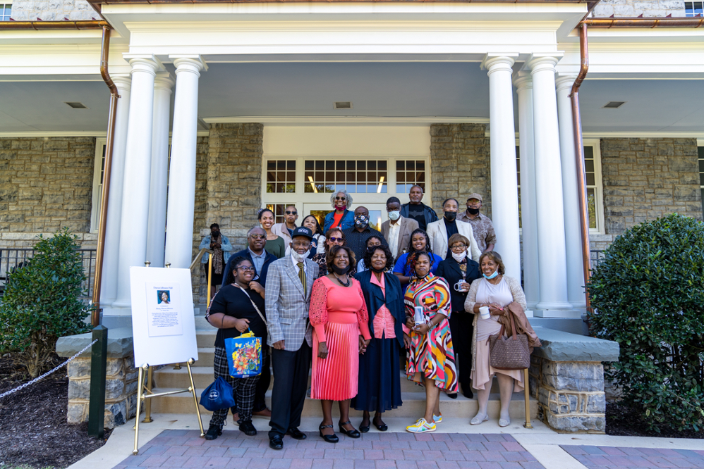 photo of friends in front of Darcus Johnson Hall