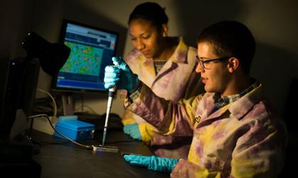 The Oxford Nanopore MinION is the newest and smallest DNA sequencer in the world. It's not yet on the market, but is being evaluated in both the Herrick and Temple labs. Here, undergraduates Jesmine Roberts-Torres and Curtis Kapsak load the MinION.