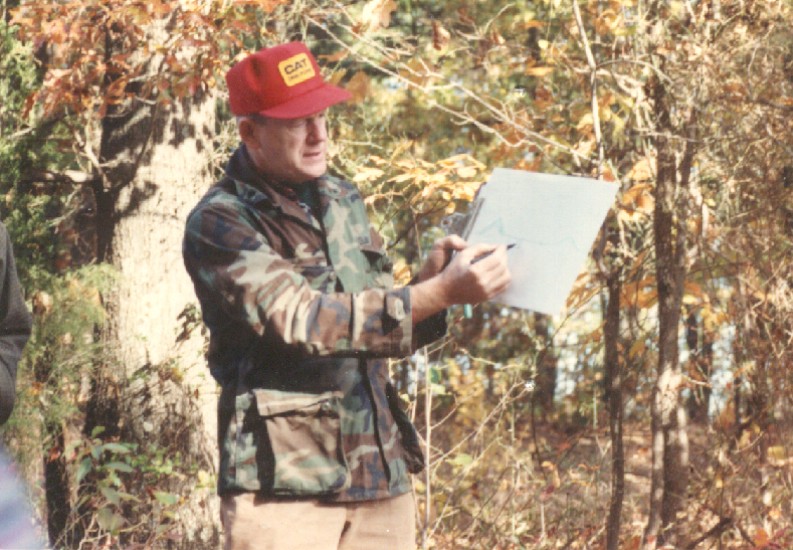 Cullen Sherwood demonstrates a geology principle while out in the field.