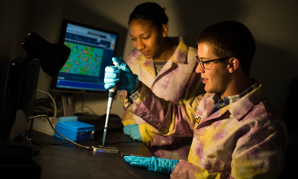 Professor and student in biology lab