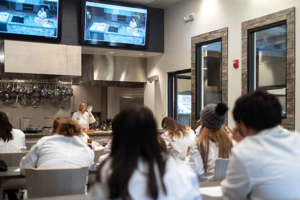 students and professor in culinary classroom