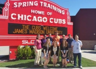SRM Baseball Camp Group in front of Chicago Cubs Training Sign in March 2016