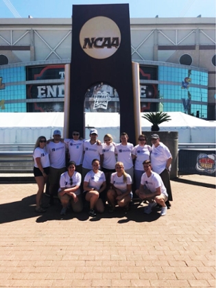 SRM students posing in front of the NCAA sign